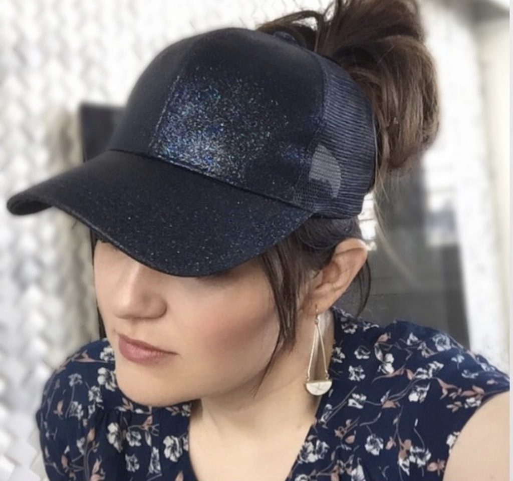 Messy Bun Hats - The best fifth day hair hack by Popular Utah Blogger and Top Maskcara Beauty Artist, Kelly Snider; image of woman wearing a navy blue sparkly messy bun.