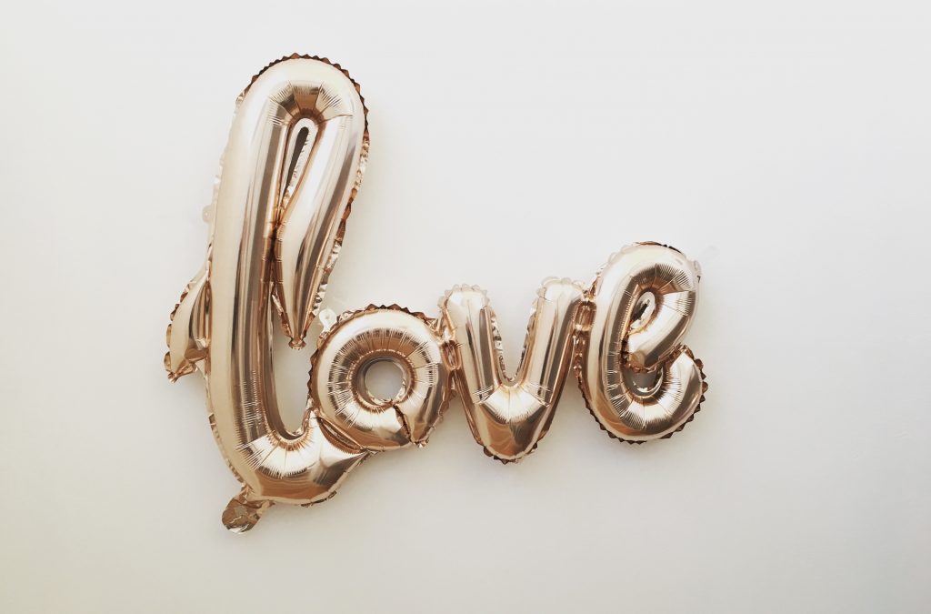 10 Unique Valentine's Date Ideas by popular Utah life and style blogger, Kelly Snider: image of a gold love balloon. 