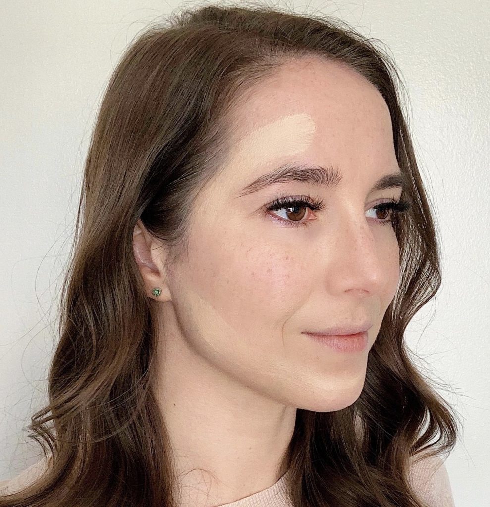 How to Contour in 5 Easy Steps by popular beauty blogger and top artist with Maskcara Beauty, Kelly Snider; Image of of first step applying the main highlight color.