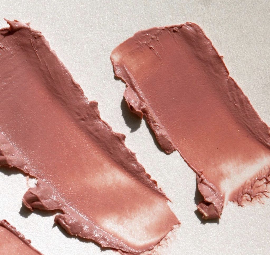sharing how long Seint foundation lasts. Image of Swatch of Seint Cream lip+cheek color.