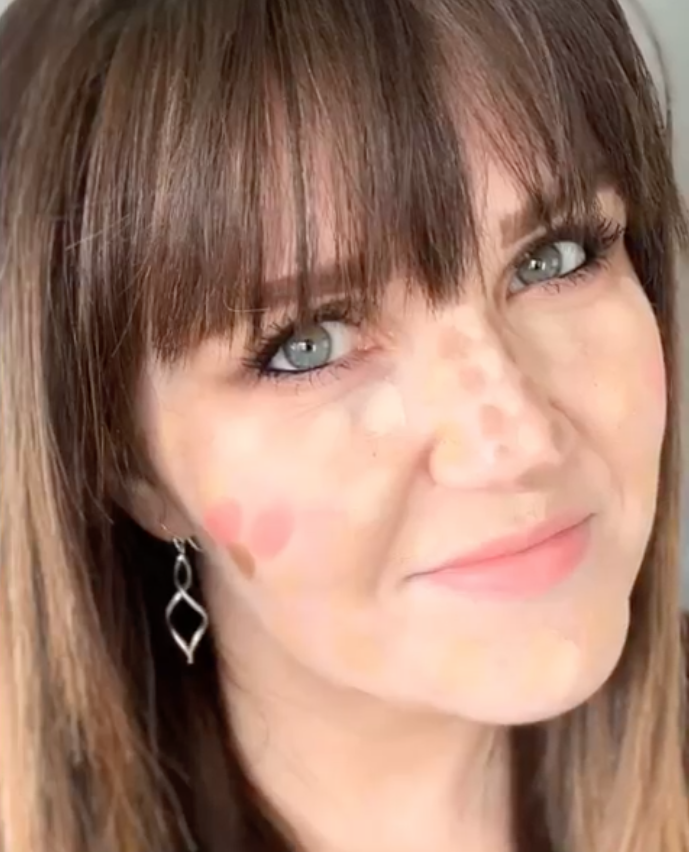 Picture of Kelly Snider (woman) with makeup dotted all over her face. Kellysnider.com
