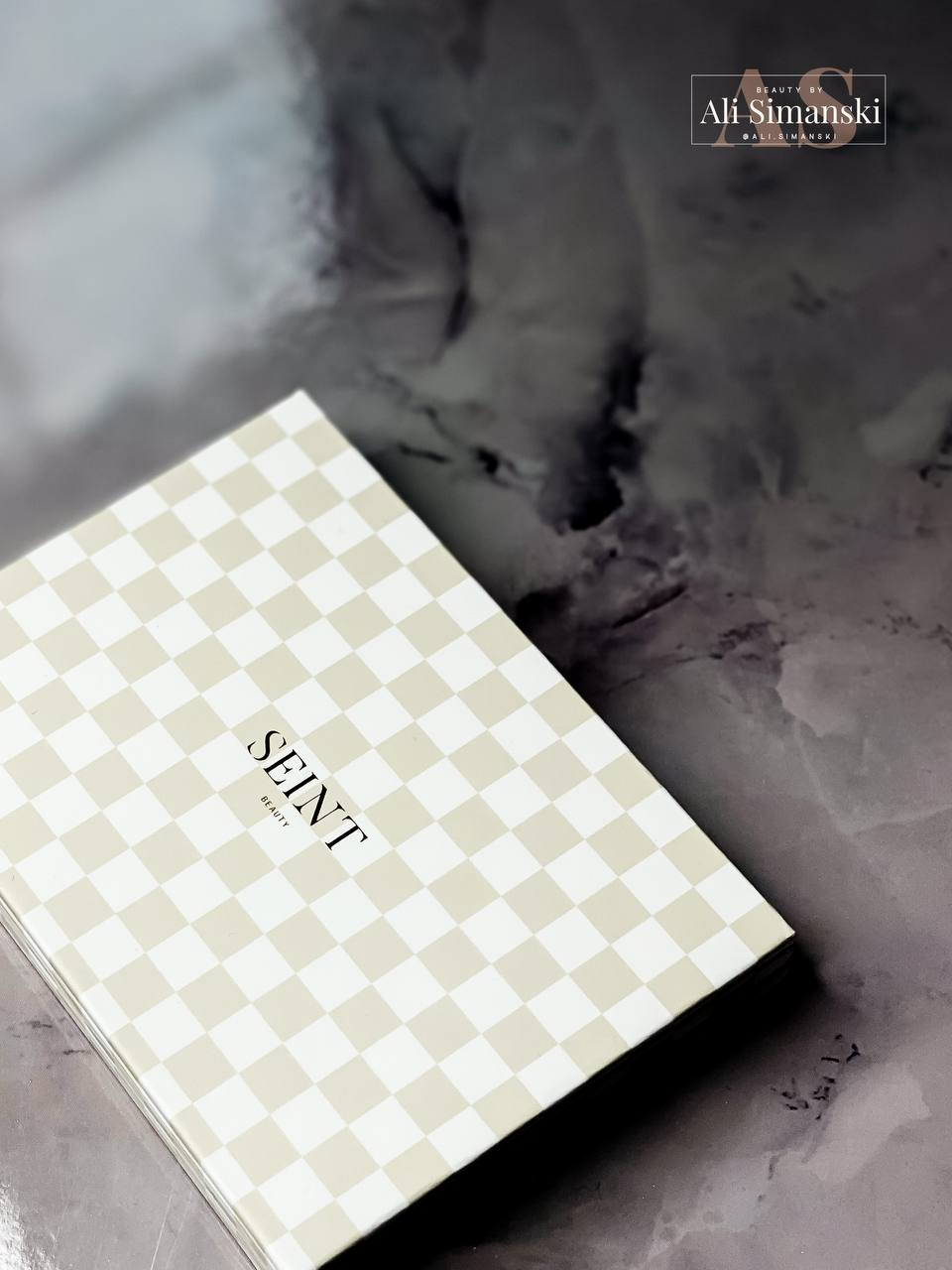 Picture of Seint IIID Foundation all-in-one palette that can be used to color correct. It's beige checkered and brand new.