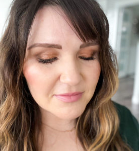 Picture of Kelly Snider with her eyes closed displaying her use of the BEST eyeshadows for beginners